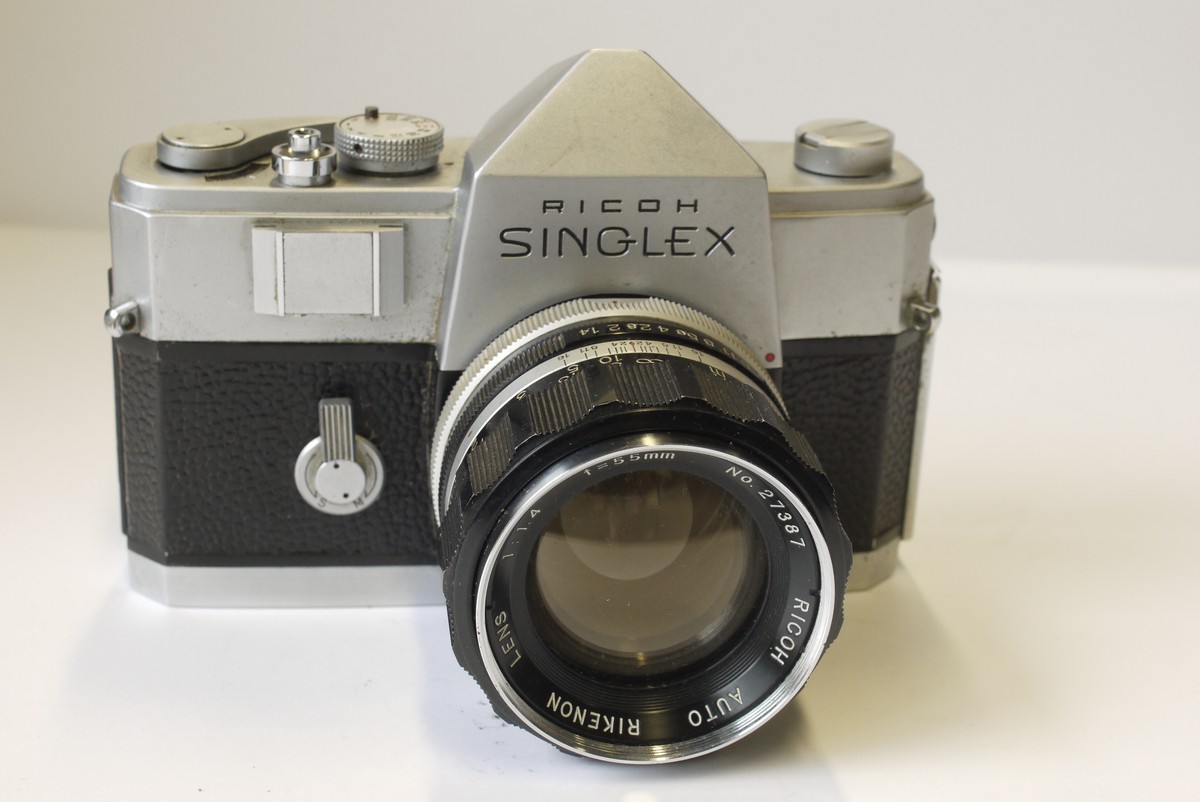 mwclassiccameras-20230407-50 Ricoh Singlex 35mm SLR, chrome + 55mm f1.4 Rikenon Nikon F mount lens. Ricoh front lens cap & ER case
