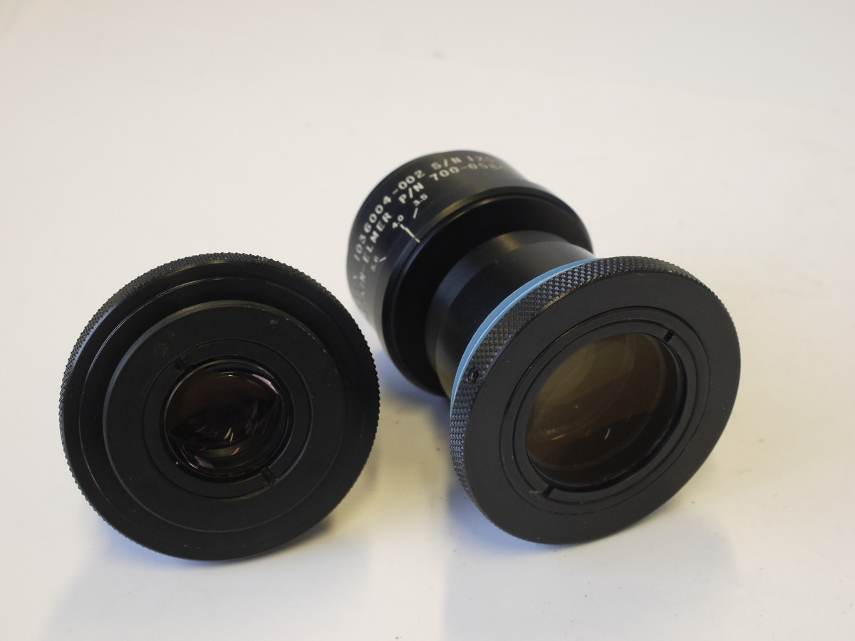 mwclassiccameras-20230420-51 Perkin Elmer Set of Two lenses, 9.48X & 5.62X, both f5.6, (No.s 1036004-001 & 1036004-002), engrasved P/N 700-0584 & P/N 700-0594, both with Iris Diaphragms & flanges. PROBABLY FOR SCIENTIFIC USE