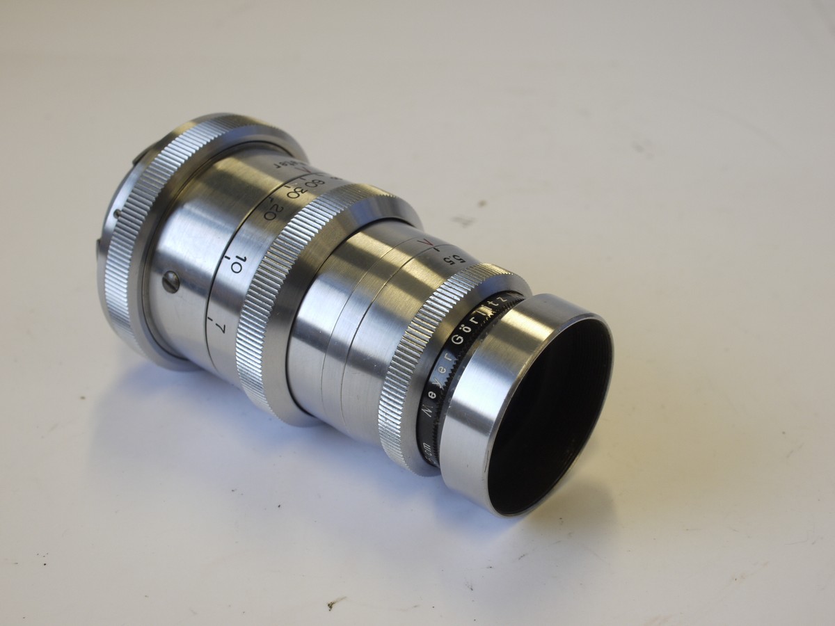 mwclassiccameras-20230420-75 Meyer Gorlitz 15cm f3.5 Tele Megor all chrome manual focus Exakta mount lens, with makers lens hood & Zeiss 2-part brown lens case. Heavy metal, early period lens