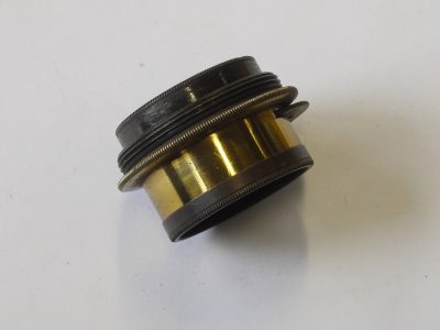 W Banks, Bolton 4 inch (Estimated) f11 brass lens with rotating wheel apertures + brass rear cap