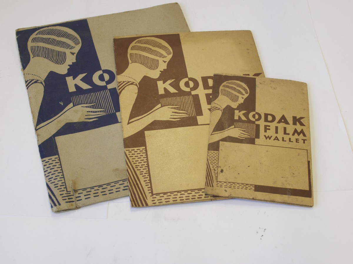 mwclassiccameras-20230526-332 Kodak Film Wallets - set of Three antique paper/card wallets for negatives with front images of woman holding an early box camera