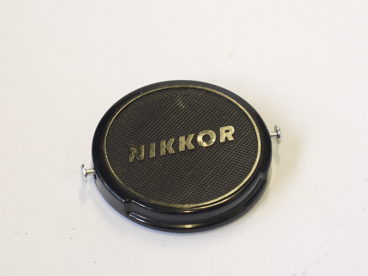 Genuine Nikon NIKKOR 52mm Clip-on Front Lens Cap – Japan, Snap-on, Functional (Used, May Have Hairline Cracks)