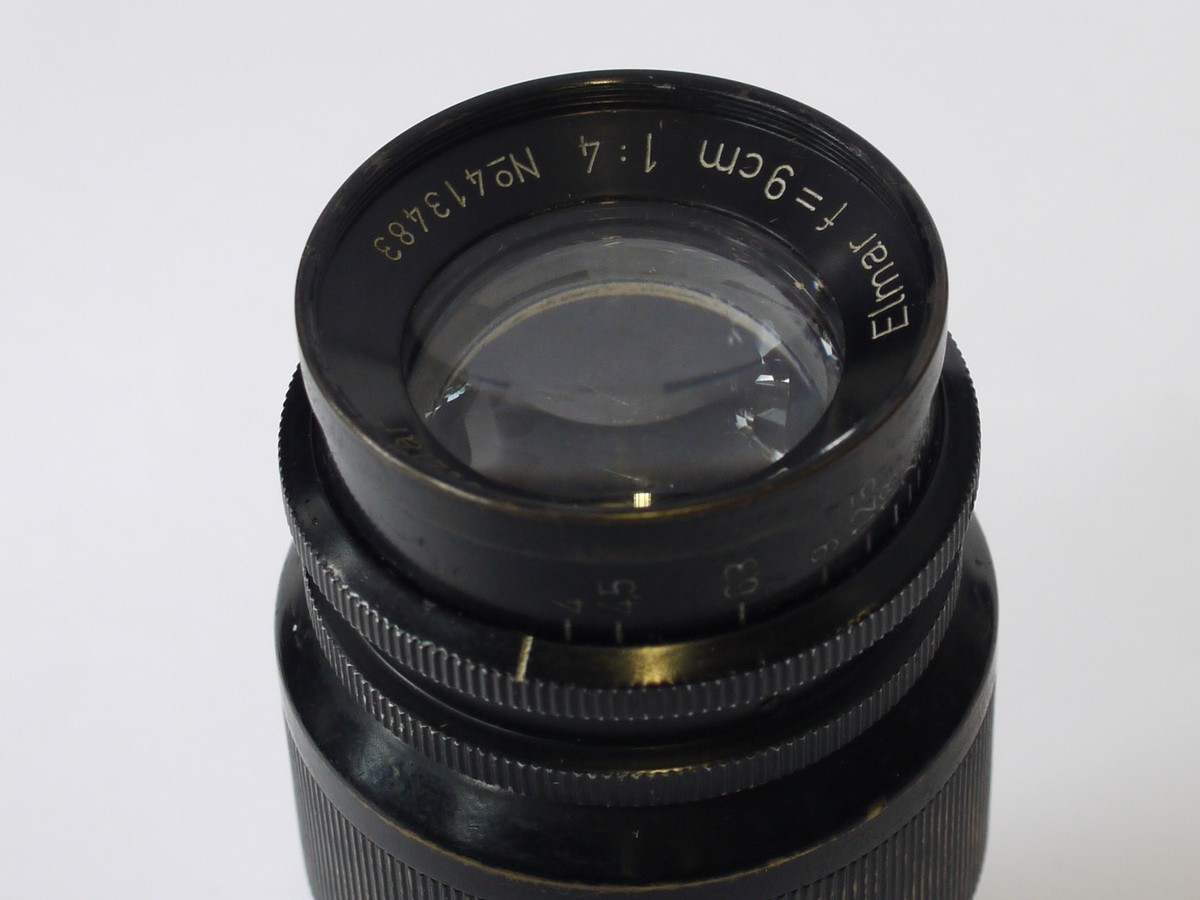 mwclassiccameras-20230804-100 Leitz 9cm f4 Elmar-L39 black with chrome bands (No.413483) + black metal rear cap