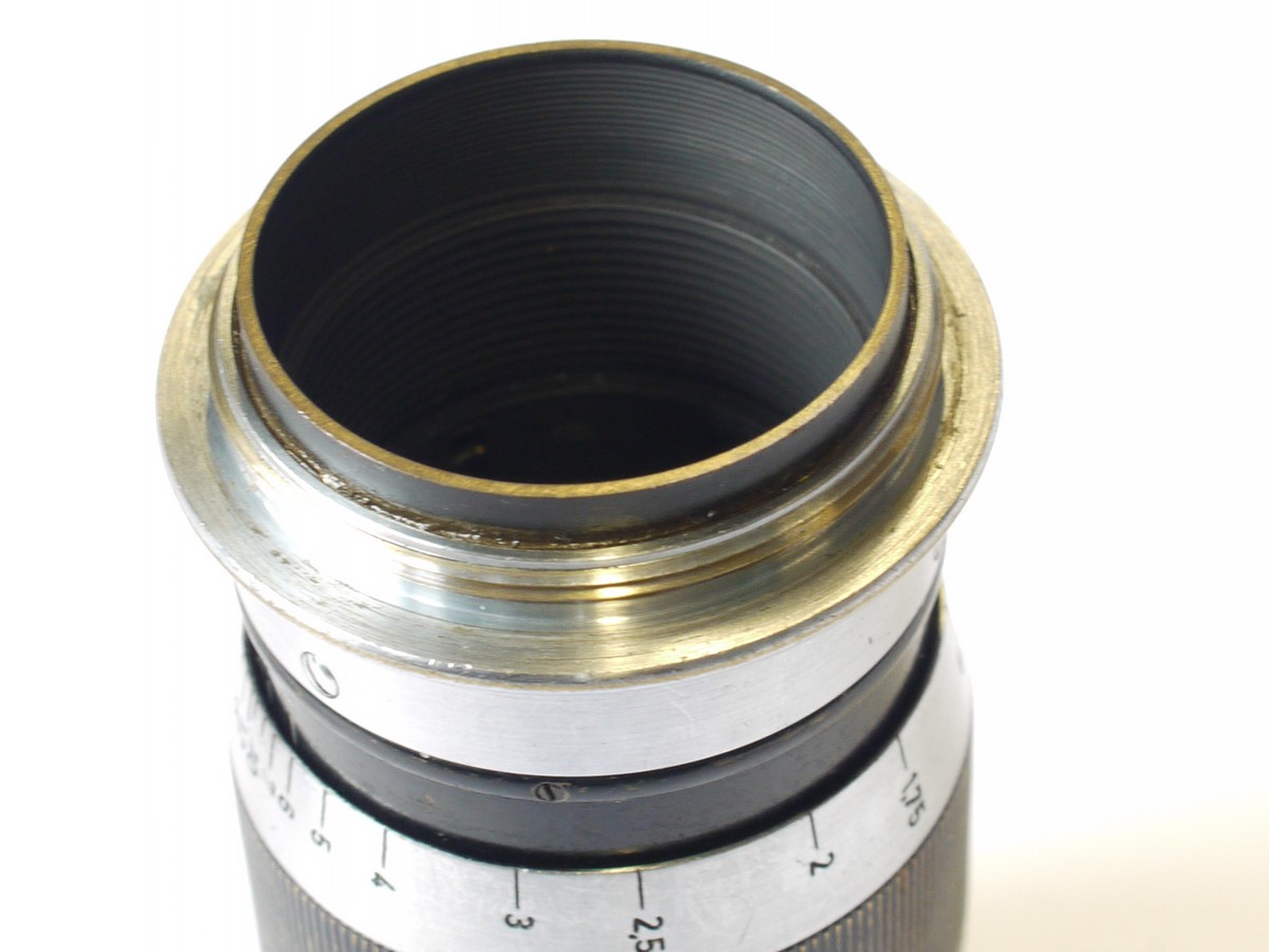 mwclassiccameras-20230804-101 Leitz 9cm f4 Elmar-L39 black with chrome bands (No.413483) + black metal rear cap