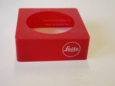 Leitz "Leica" dark red perspex lens display stand for lens diameter 52mm (65 x 65 x 25mm) Article Nr.940304