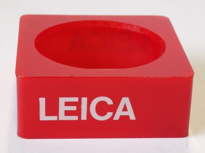 Leitz "Leica" dark red perspex lens display stand for lens diameter 60mm (82 x 82 x 30mm) Article Nr.940161