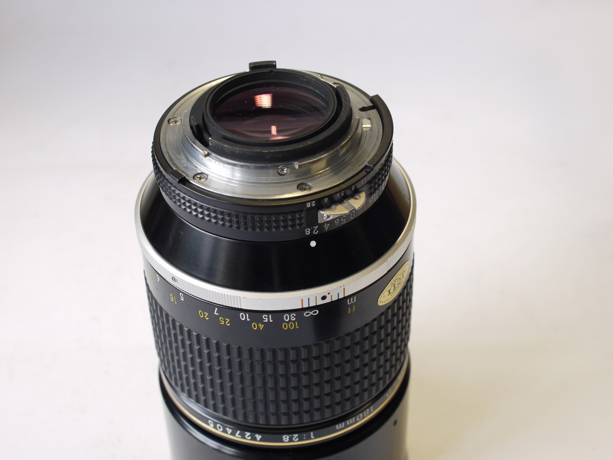 mwclassiccameras-20230908-339 Nikon 180mm f2.8 Nikkor ED manual focus AIS mount lens, with built-in lens hood + Nikon caps