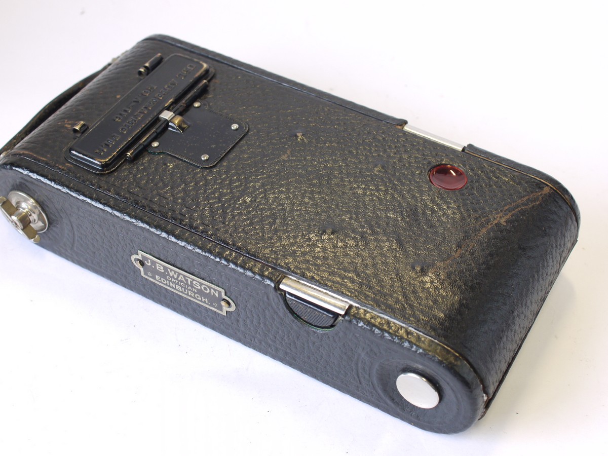 mwclassiccameras-20230908-50 Kodak No.1A Autographic Jr folding camera, all black, with Bausch & Lomb Rapid Rectilinear lens + leather case. With JB Watson name badge