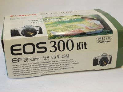 Canon EOS 300 Kit. Silver coloured 35mm AF SLR + Canon EF 28-80mm f3.5-5.6 V USM lens, Csnon caps,