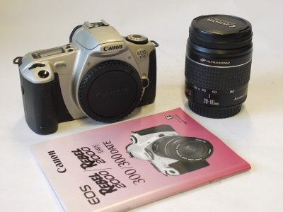 Canon EOS 300 Kit. Silver coloured 35mm AF SLR + Canon EF 28-80mm f3.5-5.6 V USM lens, Csnon caps,