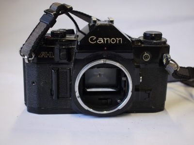 Canon A-1 35mm SLR body + Canon neck strap