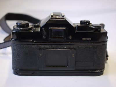 Canon A-1 35mm SLR body + Canon neck strap