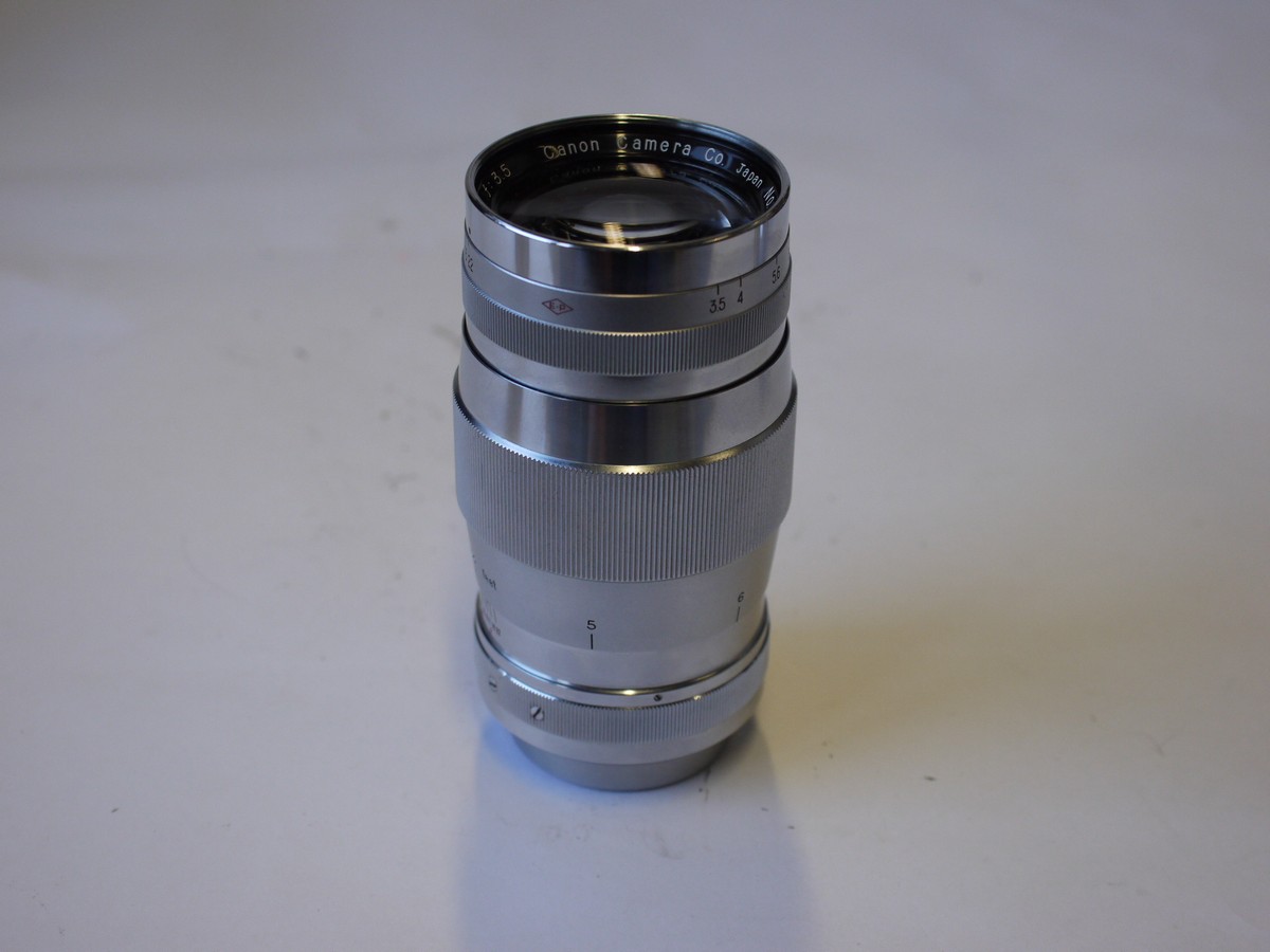 mwclassiccameras-20230929-19 Canon 135mm f3.5 All chrome lens, L39 Rangefinder coupled, with Canon 48mm UV filter, Series 7/48mm adapter ring, makers Series VII lens hood & rear cap