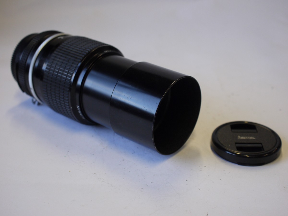 mwclassiccameras-20230929-208 Nikon 200mm f4 manual focus AI mount lens with built-in lens hood + caps
