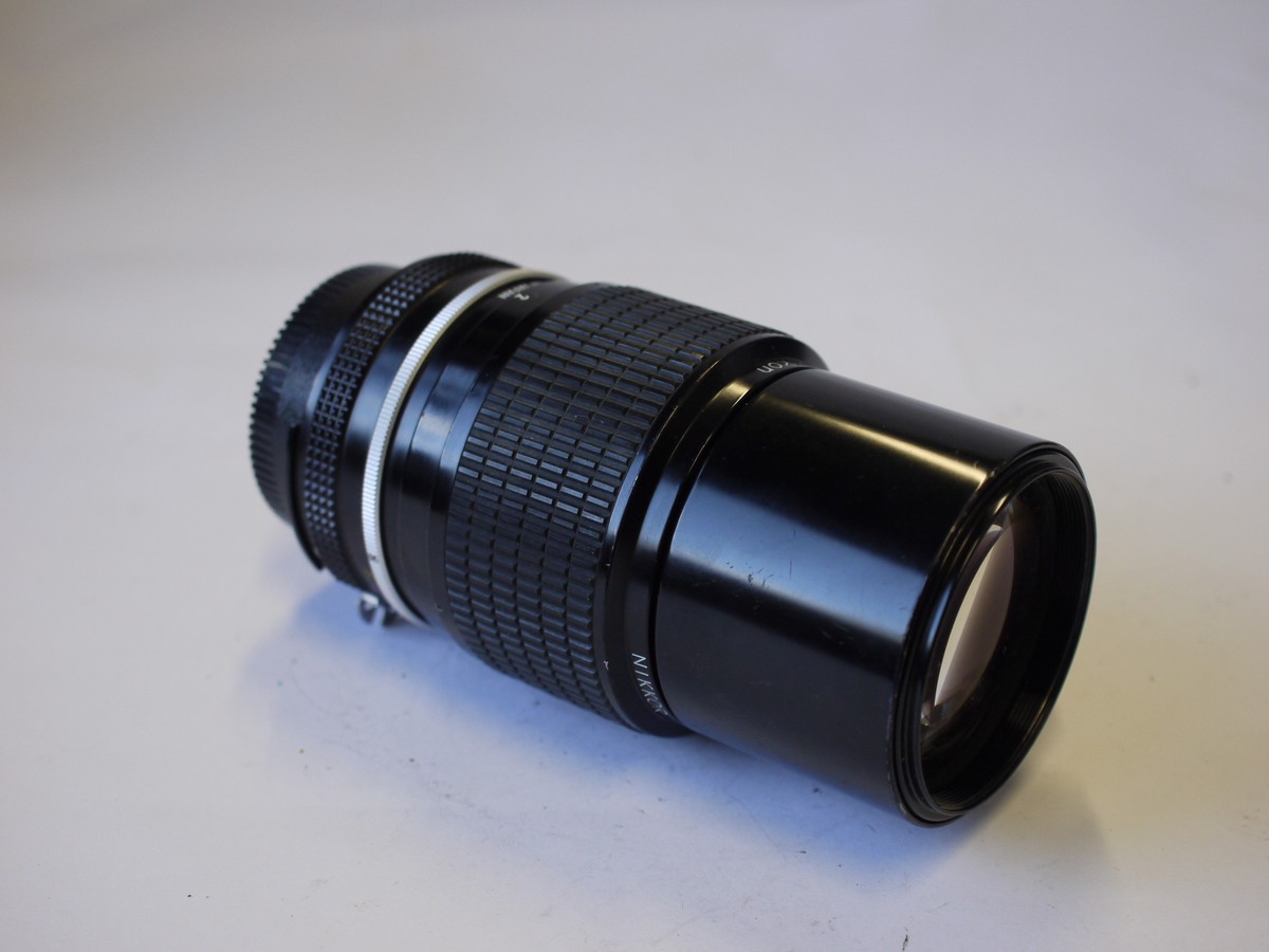 mwclassiccameras-20230929-209 Nikon 200mm f4 manual focus AI mount lens with built-in lens hood + caps