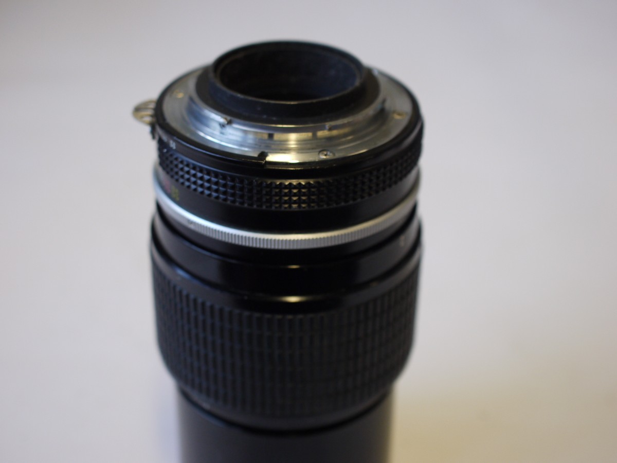 mwclassiccameras-20230929-212 Nikon 200mm f4 manual focus AI mount lens with built-in lens hood + caps