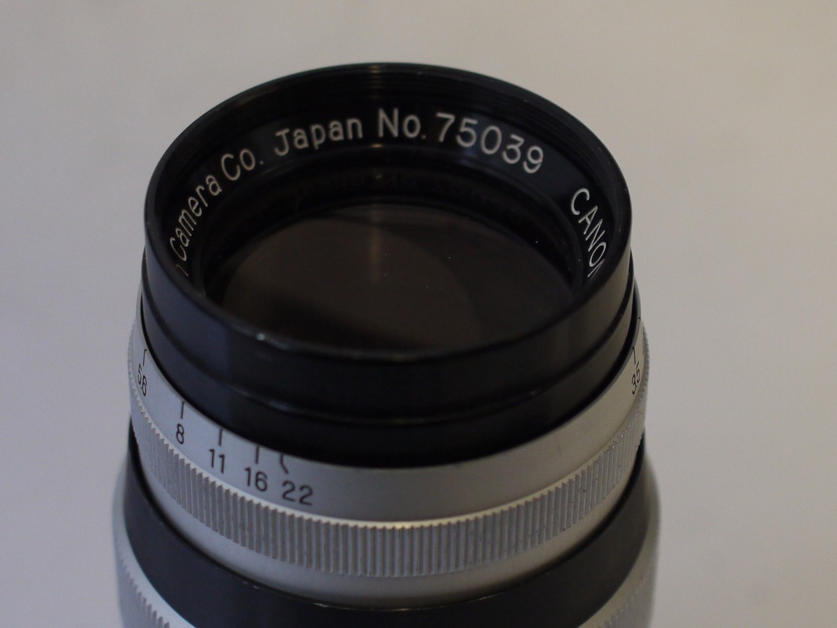 mwclassiccameras-20230929-218 Canon 100mm f3.5 black & chrome Leica L39 RF screw mount lens + chrome rear cap
