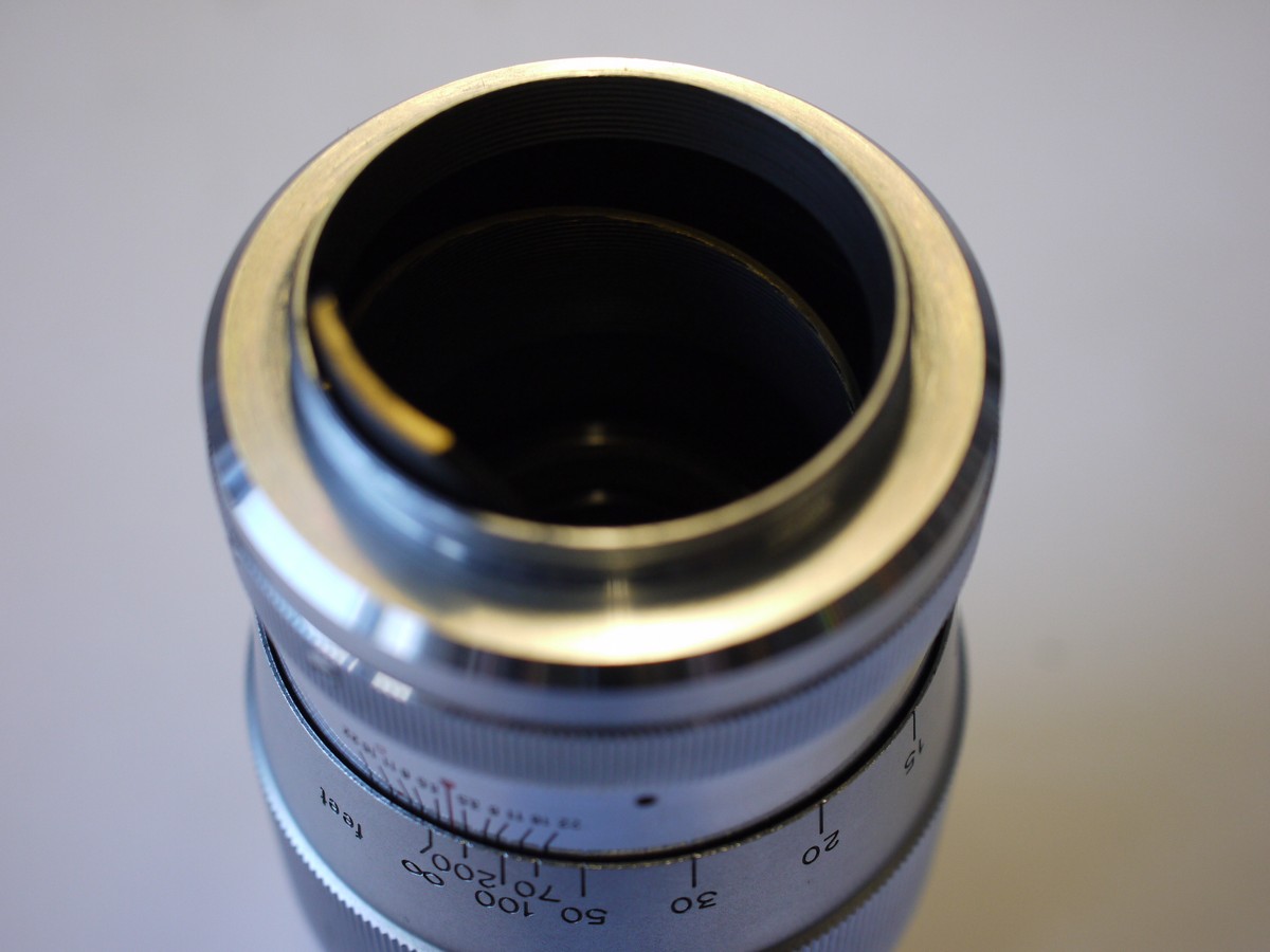 mwclassiccameras-20230929-22 Canon 135mm f3.5 All chrome lens, L39 Rangefinder coupled, with Canon 48mm UV filter, Series 7/48mm adapter ring, makers Series VII lens hood & rear cap