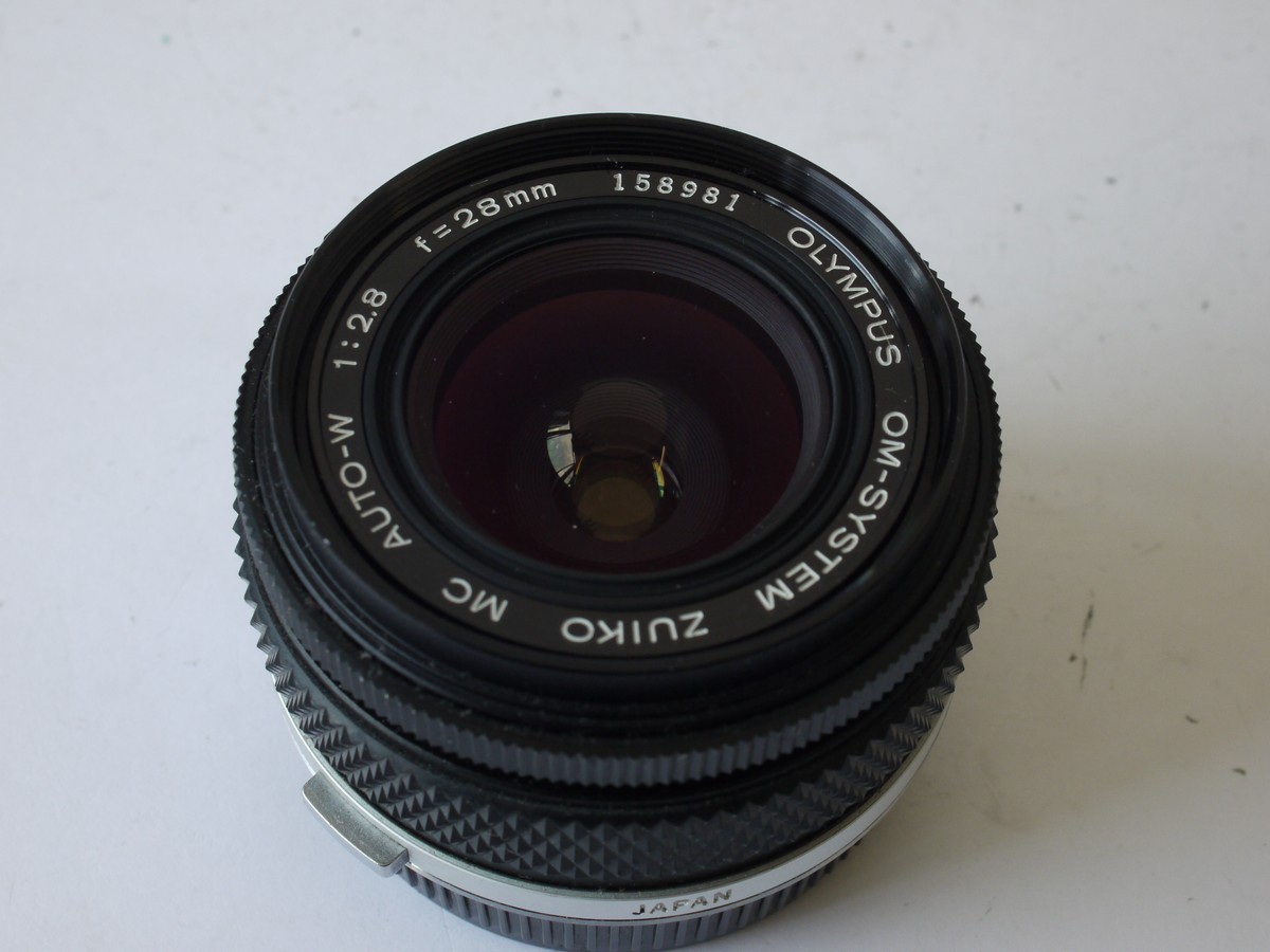 mwclassiccameras-20231006-160 Olympus 28mm f2.8 Zuiko Auto-W Manual focus OM mount lens + Skylight 1B filter & rear cap
