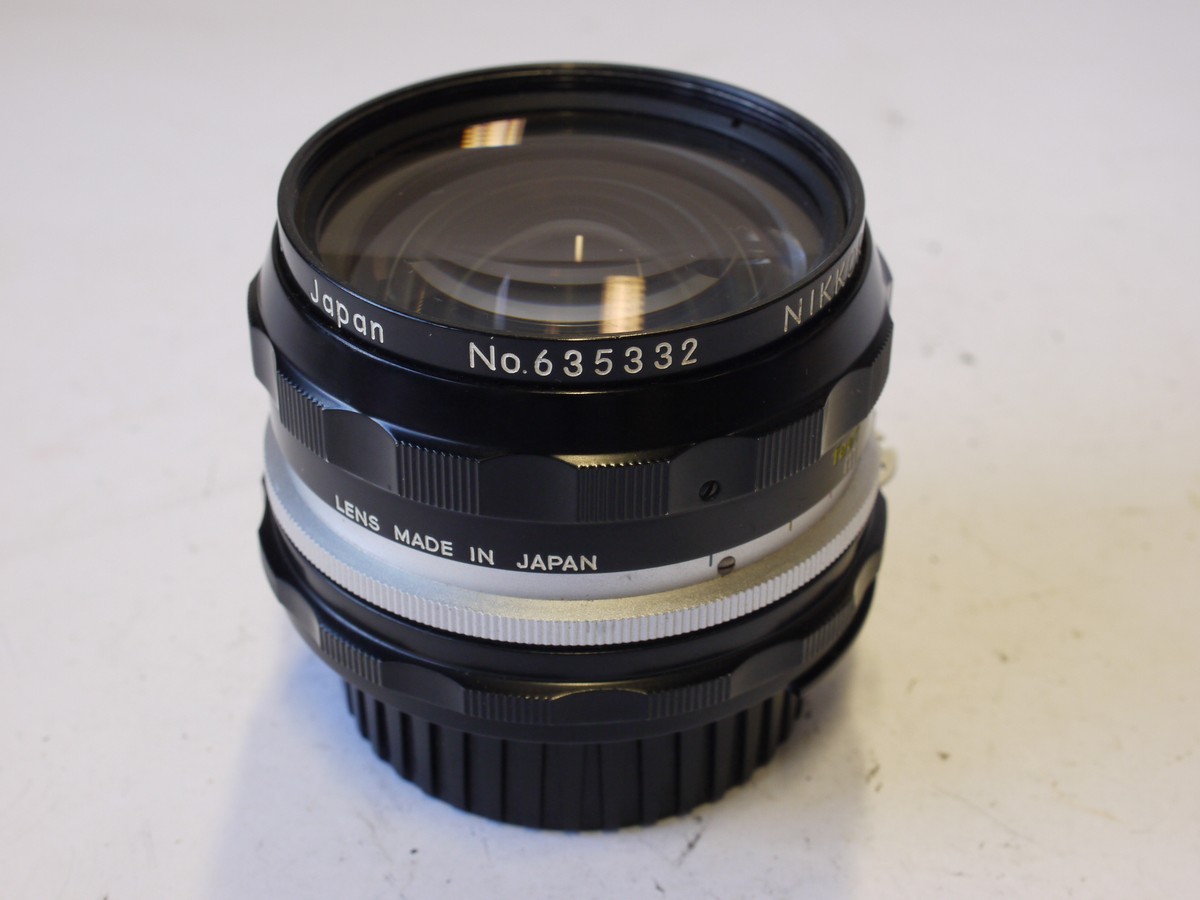 mwclassiccameras-20231013-355 Nikon Nippon Kogaku 28mm f3.5 Nikkor-H black & chrome AI mount lens + Nikon screw-in metal lens hood + Nikon caps