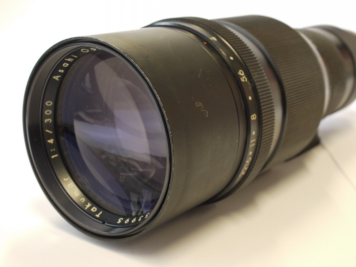mwclassiccameras-20231020-137 Pentax 300mm f4 Takumar manual focus M42 screw mount lens with Tripod mount, built-in lens hood + Pentac caps. UNCOMMON