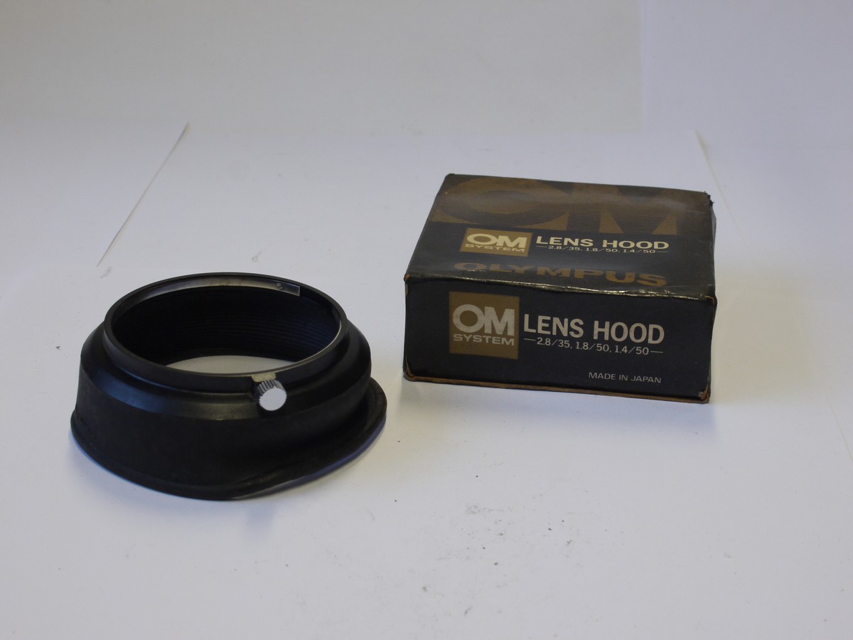 mwclassiccameras-20231020-329 Olympus push-on rubber lens hood with metal mount, for the 28mm f3.5, 50/1.8 & 50/1.4 OM lenses. With Olympus box