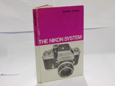 The Nikon System, book by Geoffrey Crawley c1969. Hardback. 116 pages in English