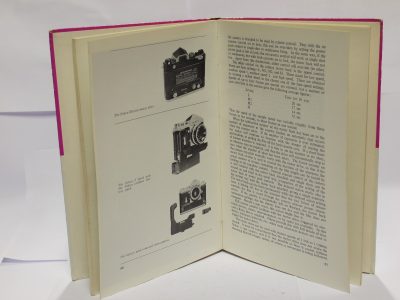 The Nikon System, book by Geoffrey Crawley c1969. Hardback. 116 pages in English
