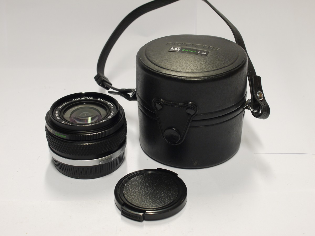 mwclassiccameras-20240126-513 Olympus 24mm f2.8 Zuiko MC Auto-W manual focus OM mount lens + Olympus screw-in metal lens hood, caps & case