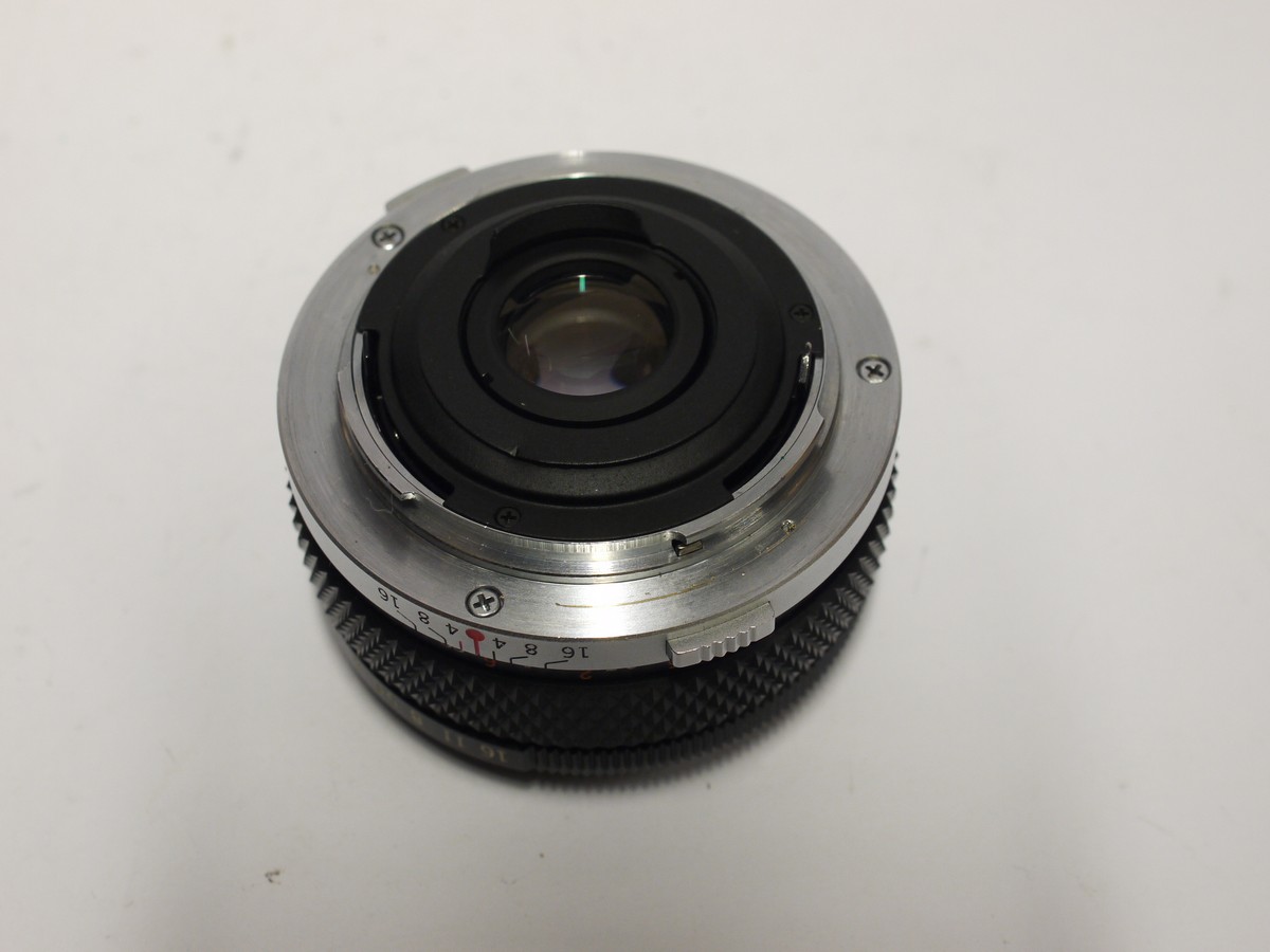 mwclassiccameras-20240126-515 Olympus 24mm f2.8 Zuiko MC Auto-W manual focus OM mount lens + Olympus screw-in metal lens hood, caps & case