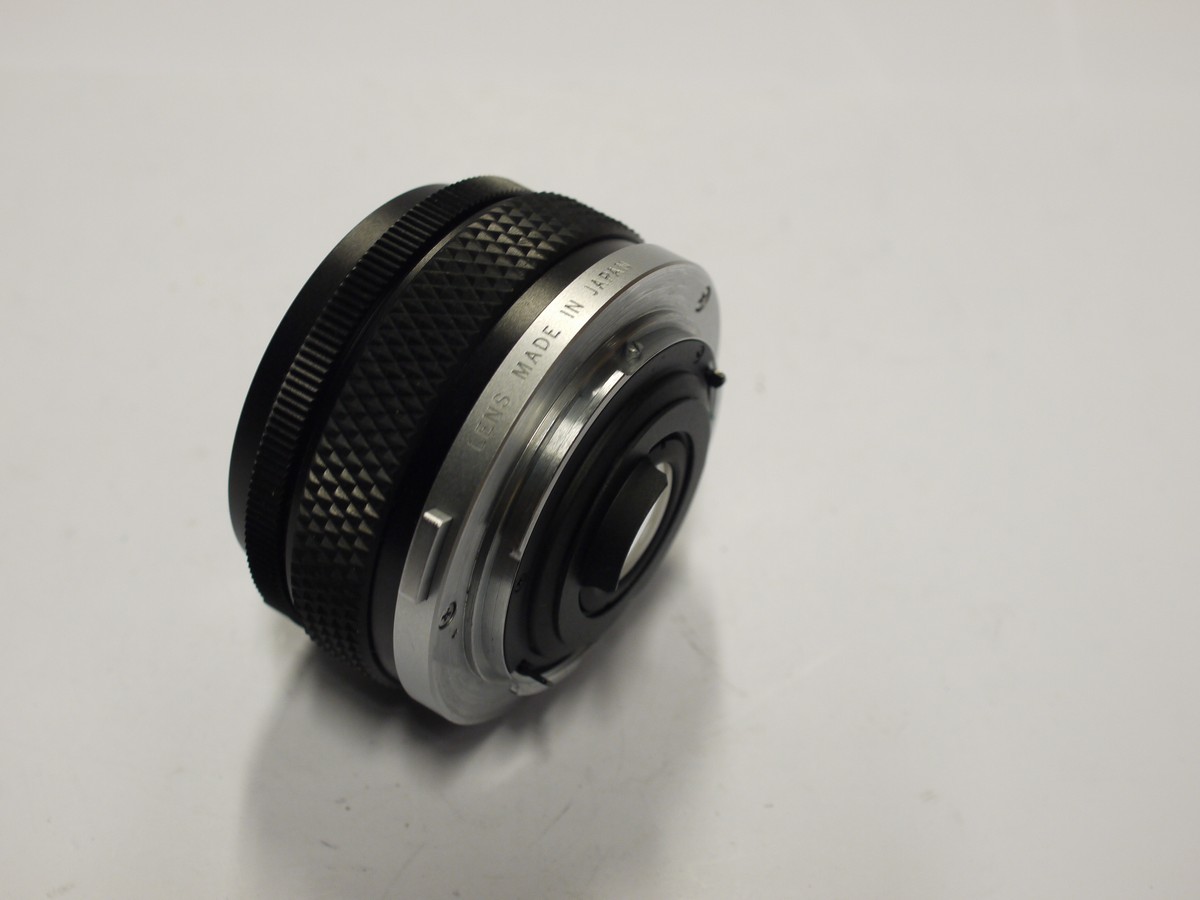 mwclassiccameras-20240126-517 Olympus 24mm f2.8 Zuiko MC Auto-W manual focus OM mount lens + Olympus screw-in metal lens hood, caps & case