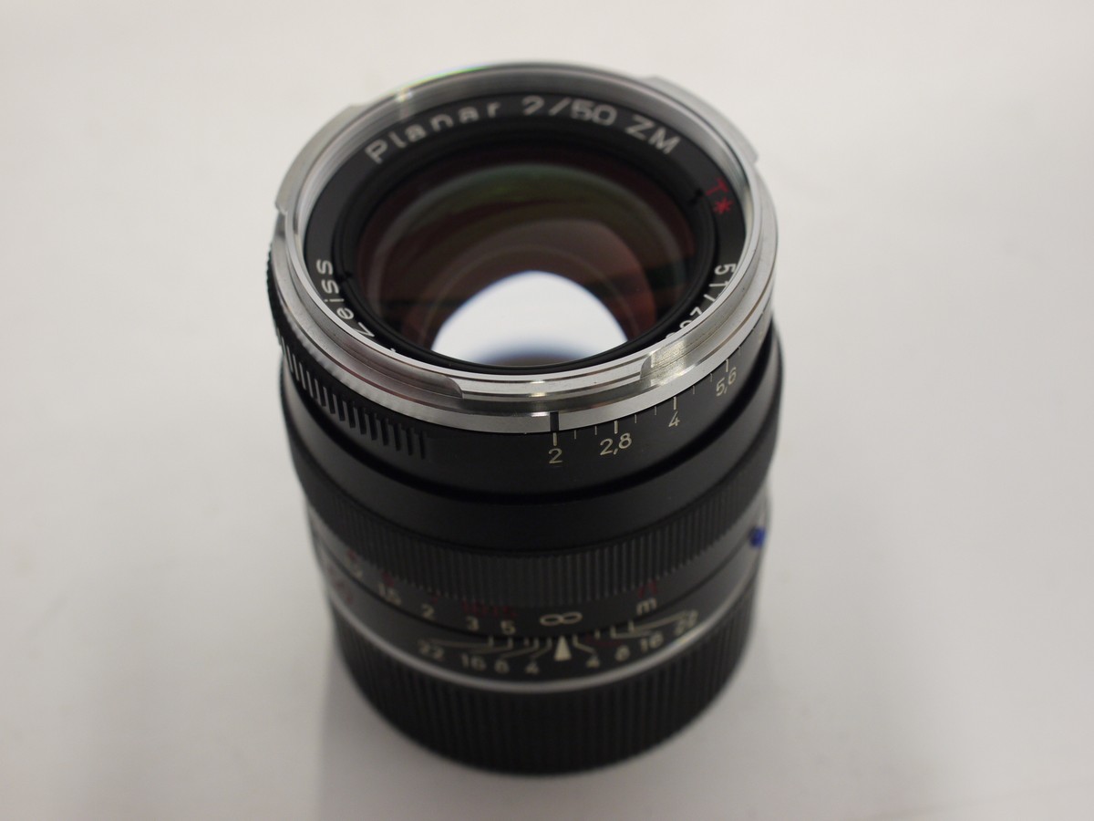 mwclassiccameras-20240126-543 Carl Zeiss 50mm f2 Planar T* ZM lens, black, Leica M RF mount + Kenko filter protector, In dependent made metal lens hoos with venbts, Leica Rear Cap & Zeiss front lens cap