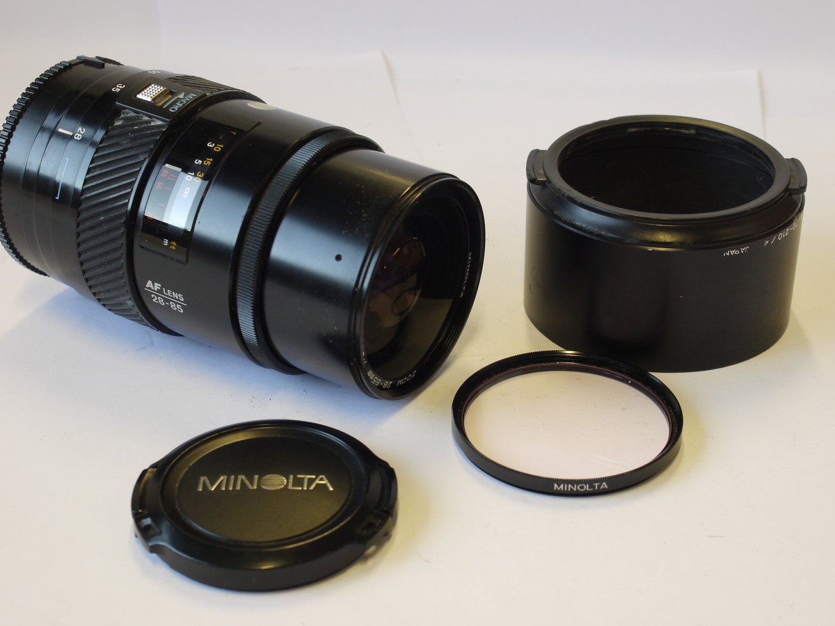 mwclassiccameras-202400202-73 Minolta 28-85mm f3.5-4.5 AF Zoom lens + Minolta Clip-on lens hood, Minolta Skylight 1B filter & caps