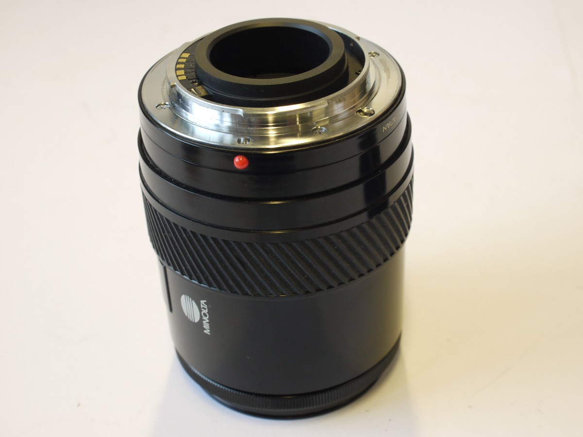 mwclassiccameras-202400202-76 Minolta 28-85mm f3.5-4.5 AF Zoom lens + Minolta Clip-on lens hood, Minolta Skylight 1B filter & caps