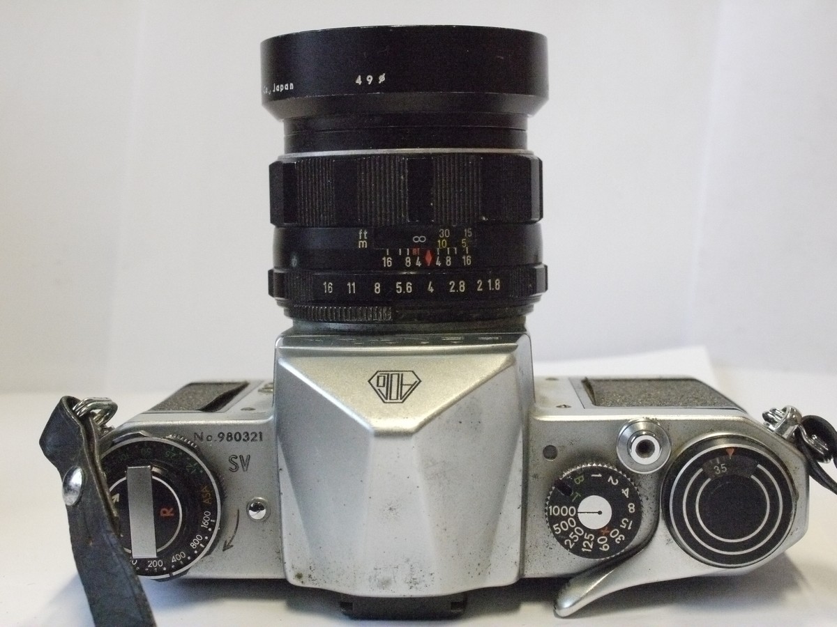 mwclassiccameras-20240229-70 Pentax SV 35mm SLR, chrome, with Pentax shutter coupled Top mounting CDs meter & 55mm f1.8 Super-Takumar M42 lens with Pentax metal lens hood & Strap