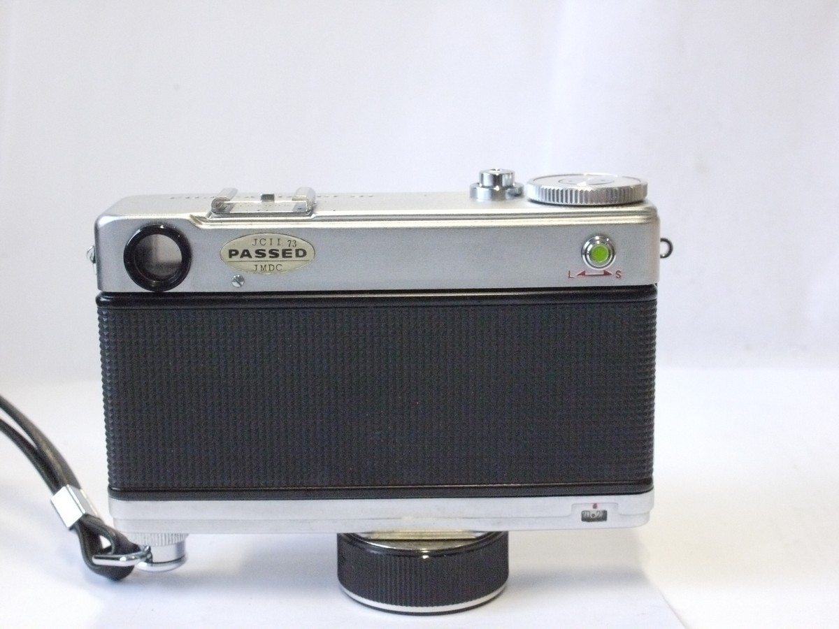 mwclassiccameras-20240229-93 Fujica Rapid D1 35mm half-frame selenium metered clockwork motorized camera with 2.8cm f2.8 Fujinon lens + wrist strap, BDB Clear filter & pouch case