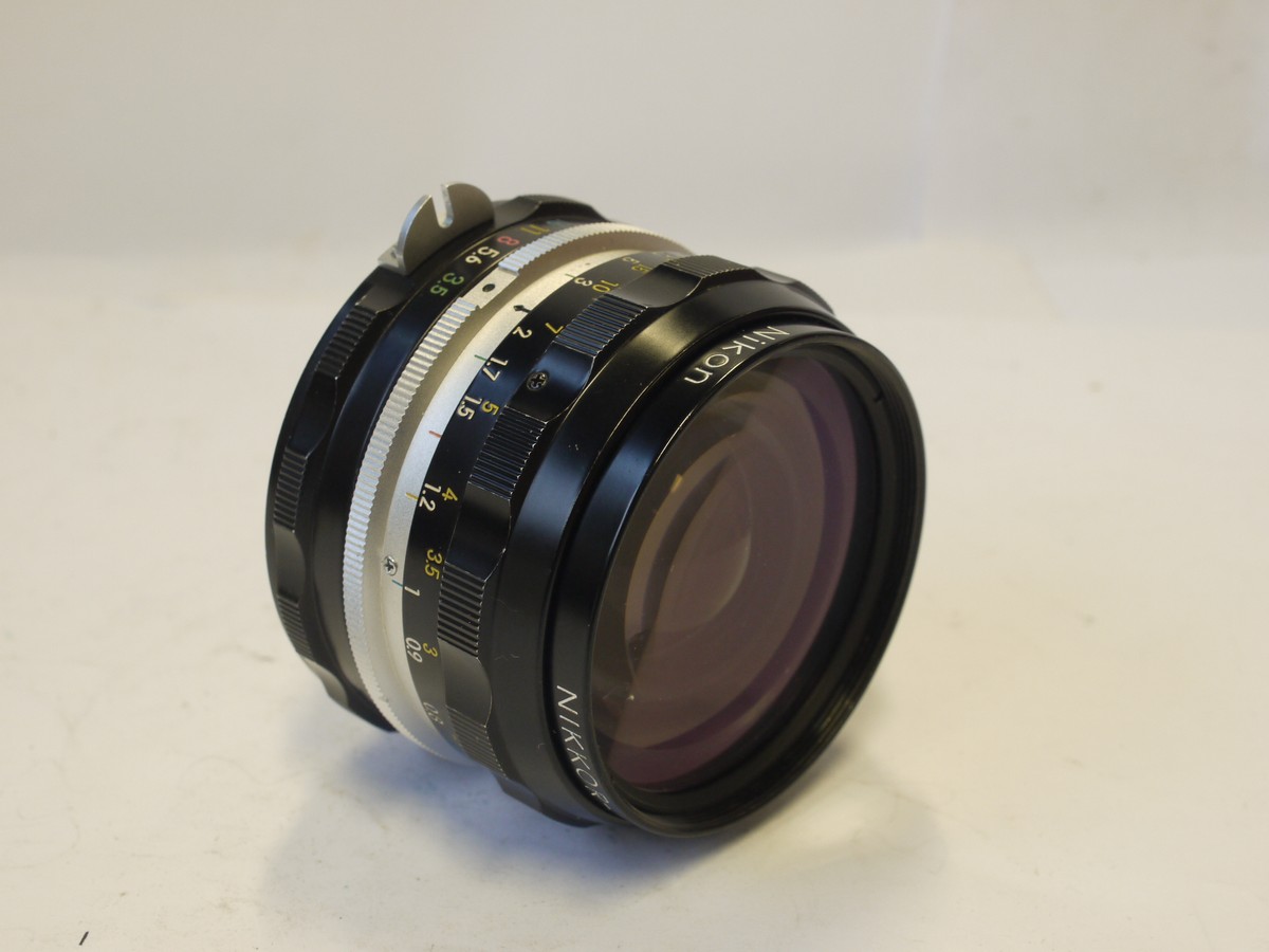 mwclassiccameras-20240308-146 Nikon 28mm f3.5 Nikkor-H.C PRE-AI lens with scalloped focusing ring + Nikon caps & Nikon Box with packaging