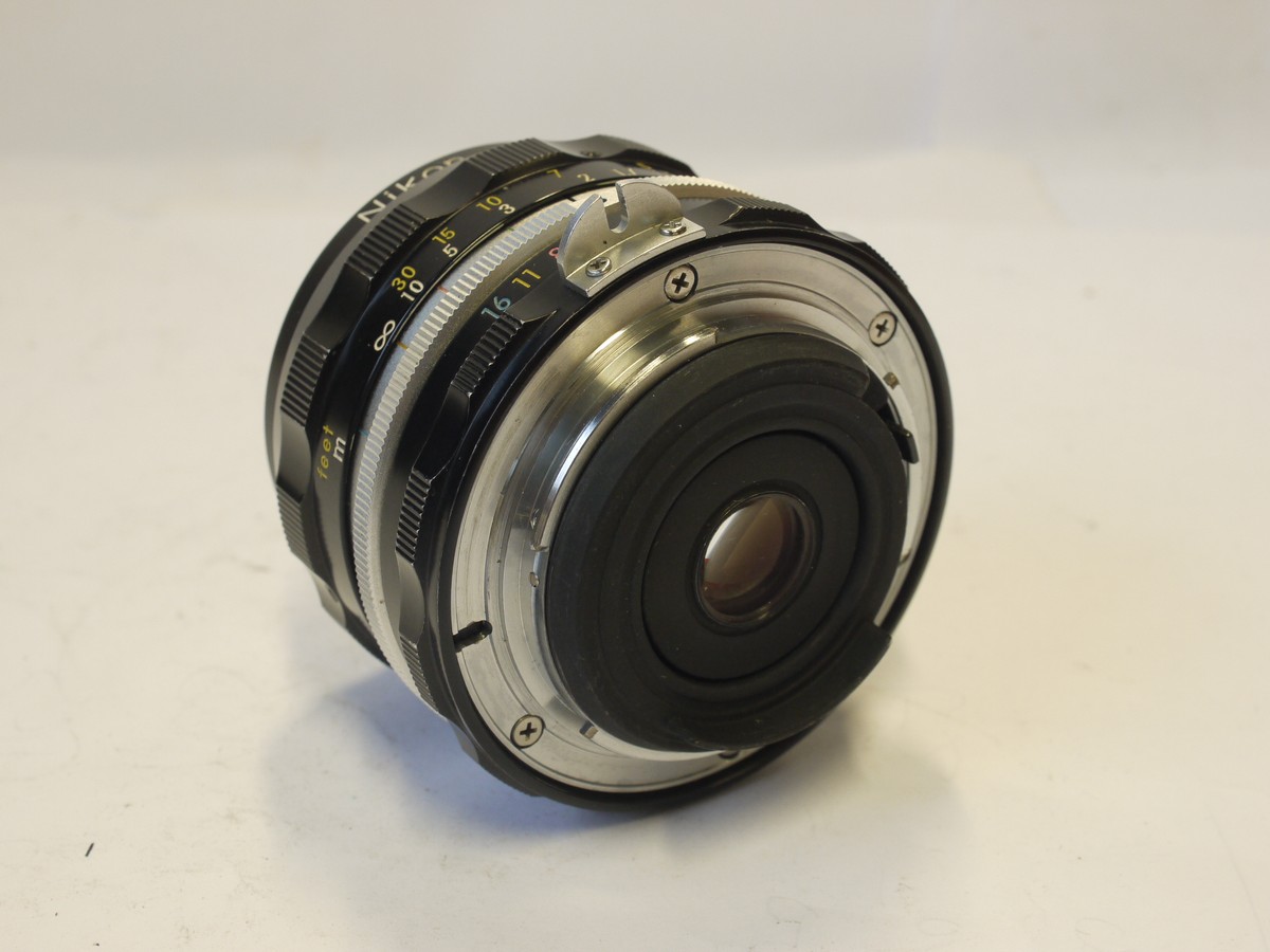 mwclassiccameras-20240308-147 Nikon 28mm f3.5 Nikkor-H.C PRE-AI lens with scalloped focusing ring + Nikon caps & Nikon Box with packaging