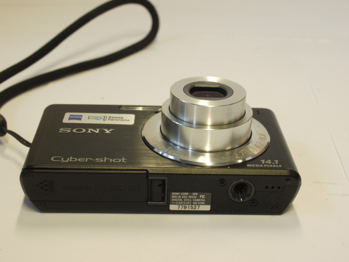 mwclassiccameras-20240315-177 Sony Cybershot DSC-W530 14.1MP Digital compact camera, Silver, with Carl Zeiss 4.7-18.8mm f2.7-5.7 Vario-Tessar 4X Optical Zoom lens + Battery Wrap Around case
