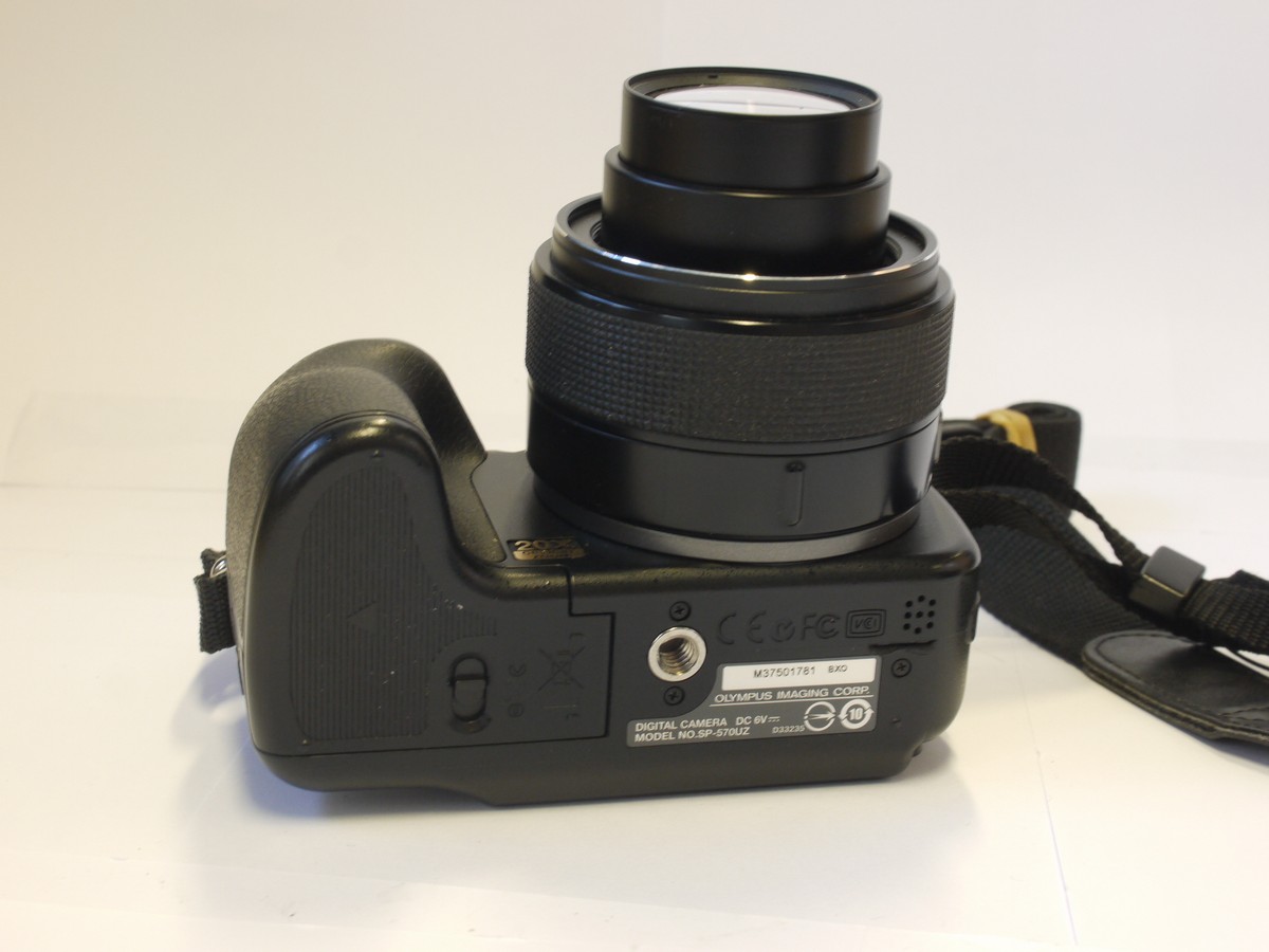 mwclassiccameras-20240315-99 Olympus SP-57OUZ 10 MP Bridge Camera, black, with 4.6-92mm f2.8-4.5 ED AFZoom lens + front cap, neck strap & case. Takes AA Batteries
