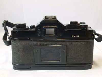 Canon A-1 35mm SLR body, with grip & neck strap