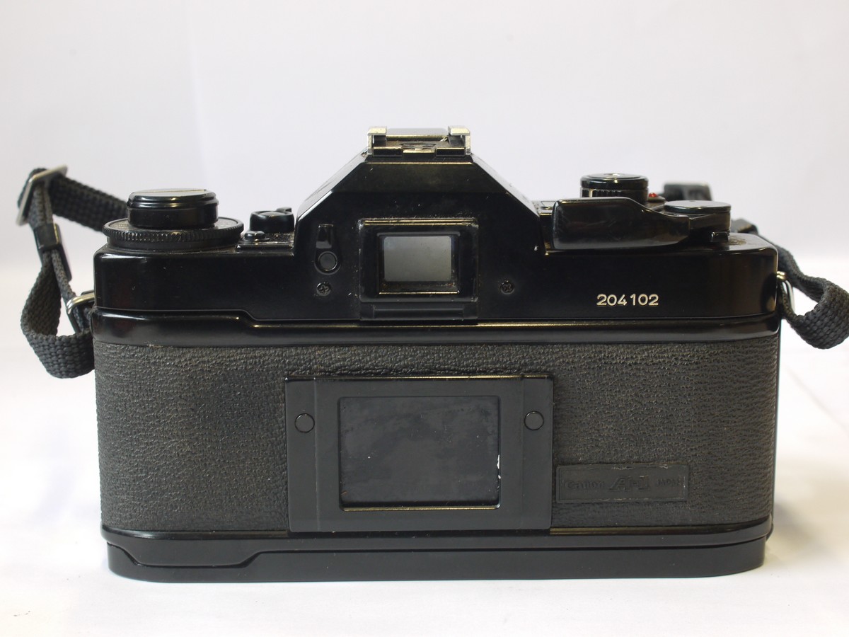 mwclassiccameras-20240405-2 Canon A-1 35mm SLR body, with grip & neck strap