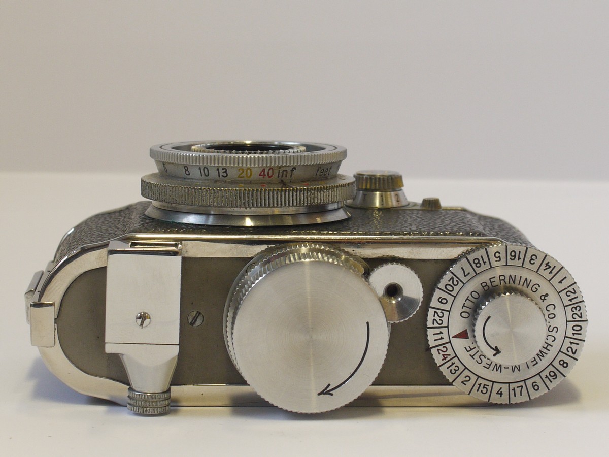 mwclassiccameras-20240412-25 Berning Robot I RARE 1st Model c1936, Heinz Kilfitt designed 24x24 on 35mm, Stainless Steel Spring motorized camera (No.20511) + Carl Zeiss Jena 3cm f2.8 Tessar Screw mount (C mount) lens, Original Cassette & Rare Robot I leather ER case. With Copy of an article on the camera