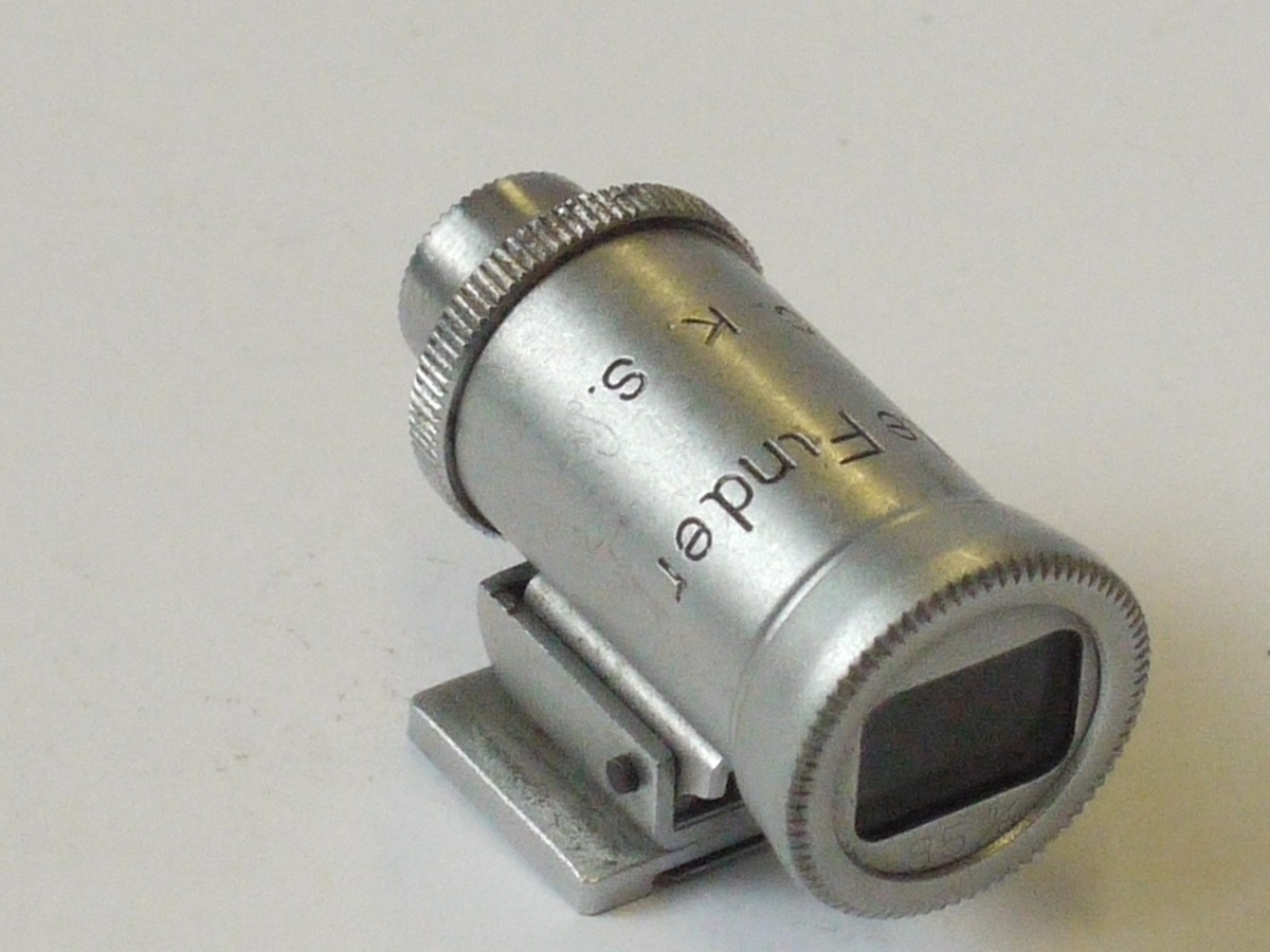 mwclassiccameras-20240426-162 C.K.S. (Minolta) 85mm Tele Finder, optical accessory shoe finder, chrome. Scale in feet