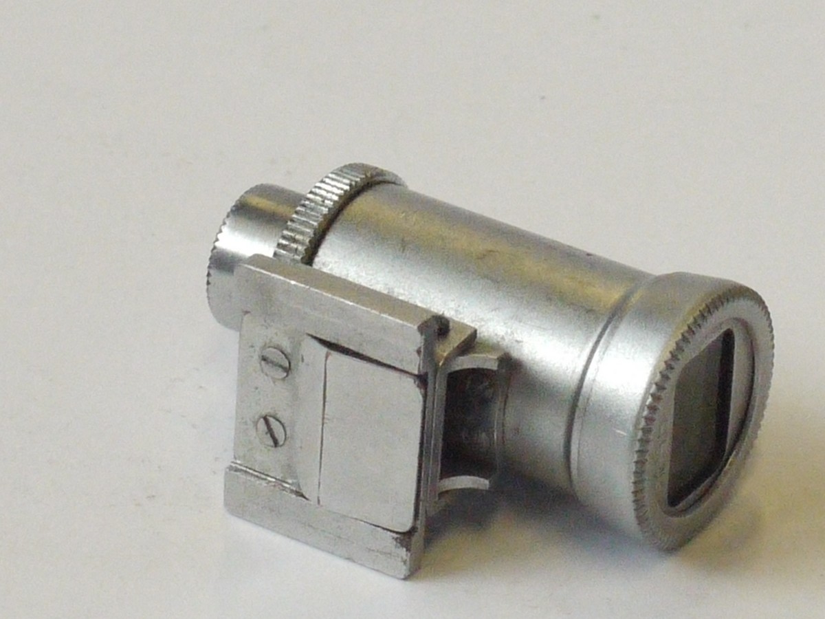 mwclassiccameras-20240426-163 C.K.S. (Minolta) 85mm Tele Finder, optical accessory shoe finder, chrome. Scale in feet