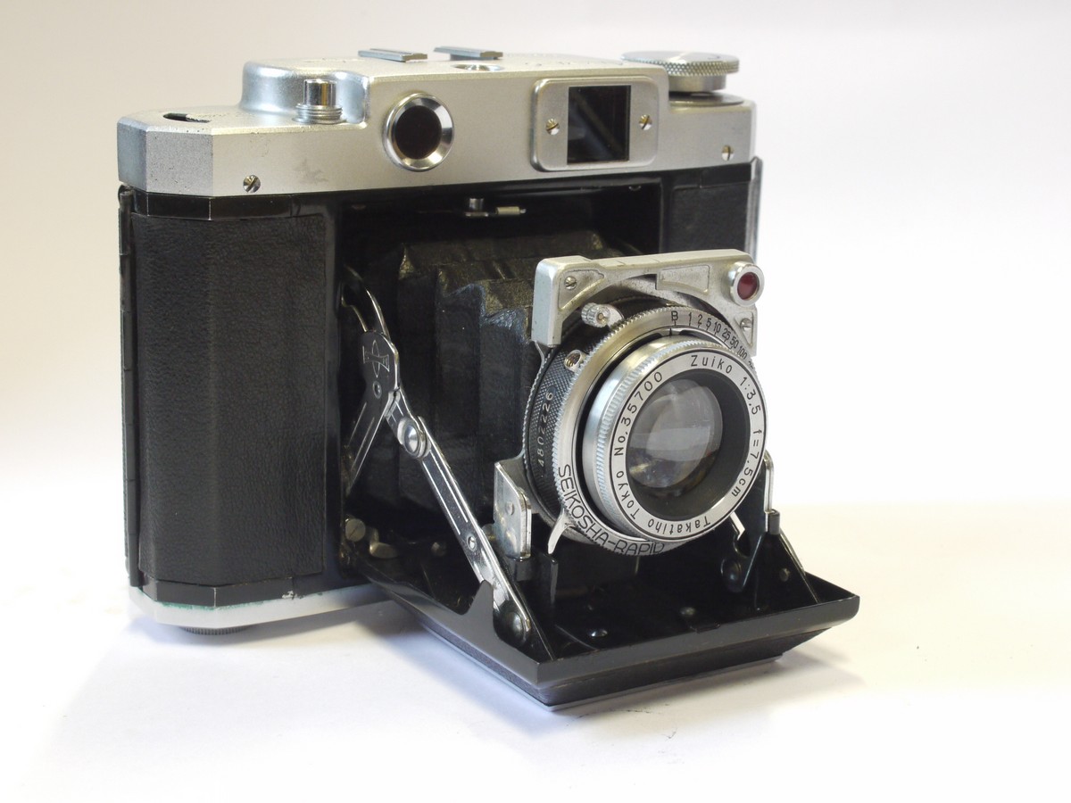 mwclassiccameras-20240503-53 Mamiya-6 IV 6x6 on 120 folding couped rangefinder (Back plate focusing system) with 7.5cm f3.5 Zuiko lens in Seikosha-Rapid shutter + ER case. UNCOMMON