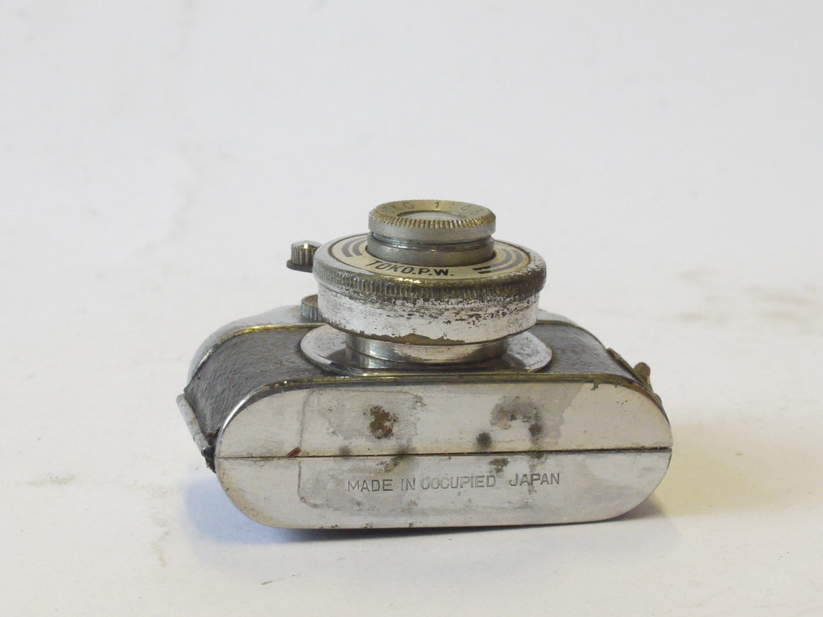 mwclassiccameras-20240510-199 Toyo Kogaku Japan Mighty 14x14 Hit Type Subminiature camera with White Face c1947, with waist-level & Eye-level finders, with f4.5 lens. With 1 spool