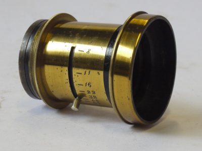 Unamed 6-7 inch (Estimated) f8 Brass lens with Iris Diaphragm + Red leather covered front cap