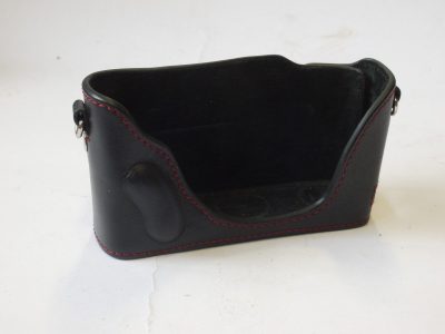 Mr Zhou Case base, black with red stitching & built-in thumb & fingers grips/contours, with velcro fixing side flap. Width is 125mm