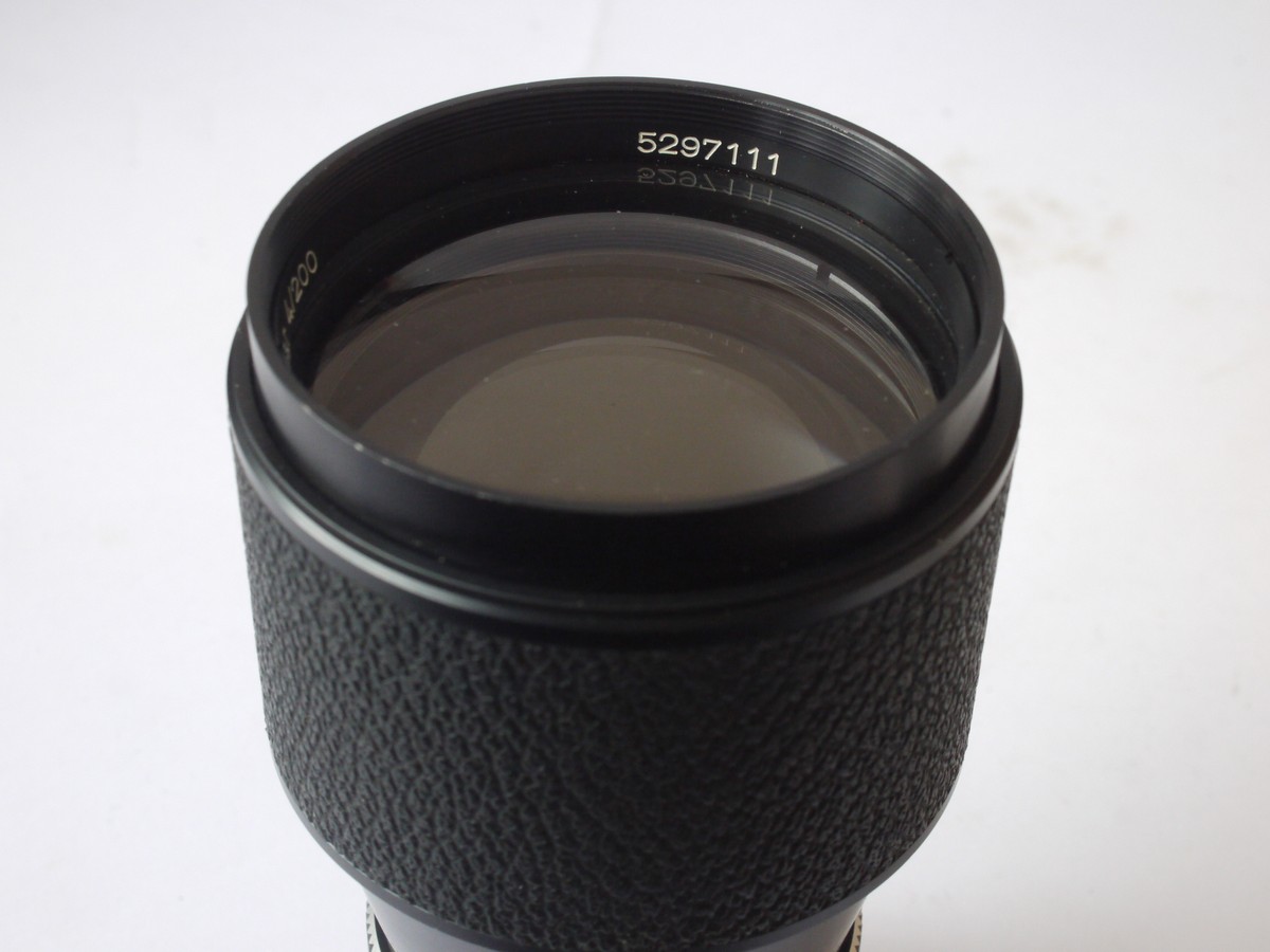 mwclassiccameras-20240517-22 Carl Zeiss 200mm f4 Tele-Tessar manual focus lens with built-in lens hood in Rollei SL35 bayonet mount + makers caps
